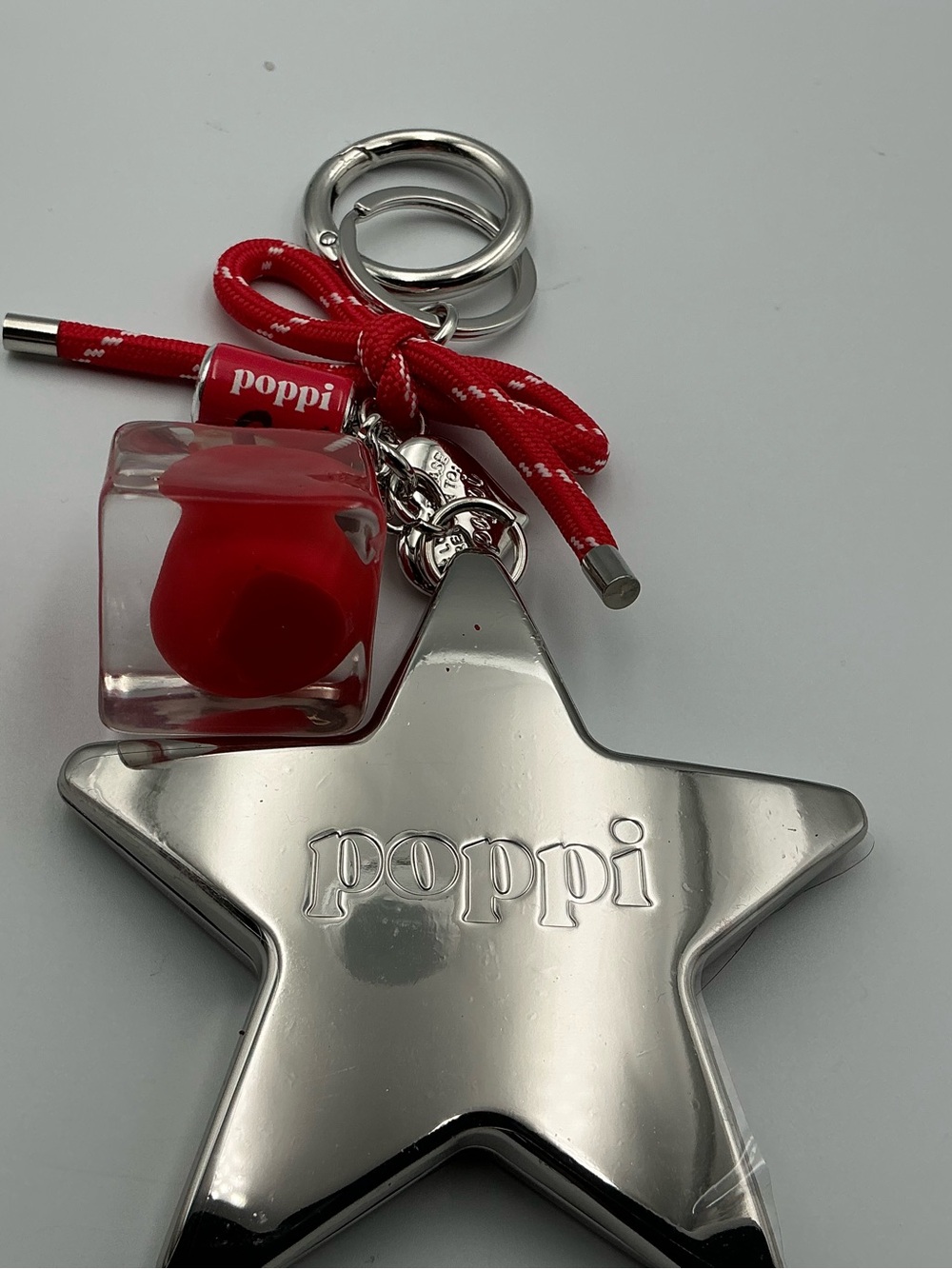 Poppi Silver Star Keychain with Red Accents